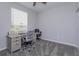 Bedroom with neutral walls and carpet, featuring a desk and chair set at 835 Grand Regency Pt # 104, Altamonte Springs, FL 32714