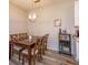 Comfortable dining room with a wooden dining table, seating for six, and a modern light fixture at 835 Grand Regency Pt # 104, Altamonte Springs, FL 32714