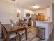 Open-concept kitchen and dining area, featuring modern appliances, stylish cabinets, and a cozy dining table at 835 Grand Regency Pt # 104, Altamonte Springs, FL 32714