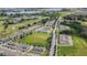 Real estate showcasing a well-planned community with homes, parks, a lake and a golf course at 9591 Amber Chestnut Way, Winter Garden, FL 34787