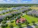 Community aerial view showcasing the playground, green spaces, and attractive townhomes in a desirable neighborhood at 9591 Amber Chestnut Way, Winter Garden, FL 34787