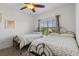 Bedroom with natural light that has two beds with matching furniture at 9591 Amber Chestnut Way, Winter Garden, FL 34787