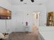 Bedroom featuring a television, carpeted floors, and access to the hall at 9591 Amber Chestnut Way, Winter Garden, FL 34787