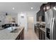 Open kitchen featuring a granite island, stainless steel appliances, and easy access to the living area at 9591 Amber Chestnut Way, Winter Garden, FL 34787