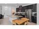 Bright kitchen with granite island, stainless steel appliances, and a cozy breakfast nook, perfect for Gathering meals at 9591 Amber Chestnut Way, Winter Garden, FL 34787