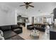 Open concept living room and kitchen area with modern appliances and comfortable seating at 9591 Amber Chestnut Way, Winter Garden, FL 34787