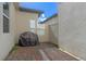 Private outdoor patio area, perfect for grilling and entertaining, featuring brick pavers and a grill at 9591 Amber Chestnut Way, Winter Garden, FL 34787