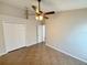 Bedroom with high ceiling, fan, and tiled floors at 14014 Spruce Creek Ln, Orlando, FL 32828