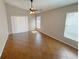 Bedroom with neutral walls, tile floor, a ceiling fan, and natural light at 14014 Spruce Creek Ln, Orlando, FL 32828