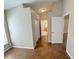 Neutral hallway features tile flooring and access to bedrooms and bathrooms at 14014 Spruce Creek Ln, Orlando, FL 32828