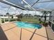Relaxing screened pool area with a view of the lake at 14014 Spruce Creek Ln, Orlando, FL 32828