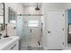 This gorgeous full bathroom features a walk-in shower with neutral tile at 10064 River Glen Ct, Orlando, FL 32825