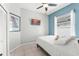 Cozy bedroom with tiled floors, modern color palette, a ceiling fan and natural light at 10064 River Glen Ct, Orlando, FL 32825
