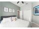 Bedroom featuring tiled floors, neutral paint, a ceiling fan, and a spacious closet at 10064 River Glen Ct, Orlando, FL 32825