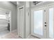 Welcoming foyer features tiled flooring, closet and bathroom access with plenty of natural light at 10064 River Glen Ct, Orlando, FL 32825