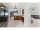 Well-lit kitchen with wooden cabinets, granite countertops, and stainless steel appliances at 10064 River Glen Ct, Orlando, FL 32825