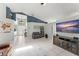 This stylish living room boasts neutral paint and an entertainment center at 10064 River Glen Ct, Orlando, FL 32825