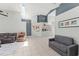 Bright living room boasts tile flooring, high ceilings with a skylight, and neutral paint at 10064 River Glen Ct, Orlando, FL 32825