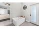 The primary bath features a soaking tub and access to the exterior backyard at 10064 River Glen Ct, Orlando, FL 32825