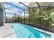 Inviting pool with a screened enclosure, perfect for enjoying a refreshing swim at 10064 River Glen Ct, Orlando, FL 32825
