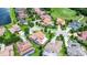 Aerial view of homes in a neighborhood with mature landscaping and a nearby golf course at 10630 Mobberley Cir, Orlando, FL 32832
