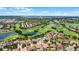 Breathtaking aerial shot showcasing a community with a lush golf course and elegant homes at 10630 Mobberley Cir, Orlando, FL 32832