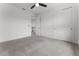 Bedroom featuring plush carpet, a ceiling fan, and access to the hallway and closets at 10630 Mobberley Cir, Orlando, FL 32832