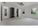 Bedroom with plush carpeting, and a ceiling fan featuring mirrored closet and ensuite access at 10630 Mobberley Cir, Orlando, FL 32832