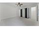 Open bedroom with carpet and fan, showing mirrored closet and adjoining bathroom at 10630 Mobberley Cir, Orlando, FL 32832