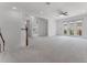 Upstairs bonus room with carpet flooring, recessed lighting, and a staircase at 10630 Mobberley Cir, Orlando, FL 32832