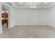 A bright dining room is shown with tile flooring, neutral walls, and a modern chandelier at 10630 Mobberley Cir, Orlando, FL 32832