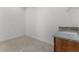 A utility room features a sink with stone countertops and cabinet space and plumbing for appliances at 10630 Mobberley Cir, Orlando, FL 32832