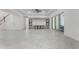 A spacious living area with tile floors, ceiling fan, and modern built-in cabinetry at 10630 Mobberley Cir, Orlando, FL 32832
