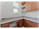 A office featuring granite countertop, custom cabinetry, and natural light at 10630 Mobberley Cir, Orlando, FL 32832