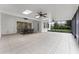 Expansive sunroom features tile floors, multiple ceiling fans, skylights and large sliding glass doors at 10630 Mobberley Cir, Orlando, FL 32832