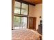 Bedroom featuring high ceilings and sliding glass doors opening to a private balcony at 116 Palm View Ct # 3535/6, Haines City, FL 33844