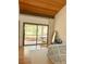 The bedroom has wood floors and sliding glass doors leading to a private balcony at 116 Palm View Ct # 3535/6, Haines City, FL 33844
