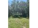 Grenlefe community sign surrounded by lush trees and greenery at 116 Palm View Ct # 3535/6, Haines City, FL 33844