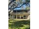 Home exterior with a large backyard featuring a two-story deck at 116 Palm View Ct # 3535/6, Haines City, FL 33844
