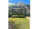 Inviting home featuring a quaint front garden, stone accents, and a second-story balcony at 116 Palm View Ct # 3535/6, Haines City, FL 33844