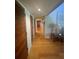 Long hallway features hardwood floors and multiple closet doors at 116 Palm View Ct # 3535/6, Haines City, FL 33844