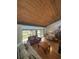 Open living room features wood floors, and a wood plank ceiling at 116 Palm View Ct # 3535/6, Haines City, FL 33844