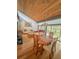 Spacious living room featuring wood ceilings, large windows, and natural light at 116 Palm View Ct # 3535/6, Haines City, FL 33844