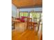 Bright living room with hardwood floors and large windows overlooking the landscape at 116 Palm View Ct # 3535/6, Haines City, FL 33844