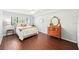 Comfortable bedroom featuring hardwood floors, a ceiling fan, and a sunlit window at 1166 Carmel Cir # 120, Casselberry, FL 32707
