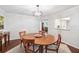 Cozy dining area with a round wooden table set on a decorative rug and light fixture at 1166 Carmel Cir # 120, Casselberry, FL 32707