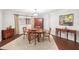 Dining room with elegant wooden furniture, artwork, a decorative rug, and window with curtains at 1166 Carmel Cir # 120, Casselberry, FL 32707
