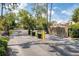 Gated community entrance offers residents a sense of security and privacy with brick walls and manicured shrubbery at 1166 Carmel Cir # 120, Casselberry, FL 32707