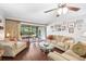 Relaxing living room with a fan and sliding doors leading to screened porch at 1166 Carmel Cir # 120, Casselberry, FL 32707