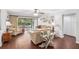 Comfortable living room with hardwood floors and views of the screened-in porch at 1166 Carmel Cir # 120, Casselberry, FL 32707